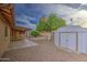 The backyard features desert landscaping, a shed for extra storage and covered patio at 9710 N 55Th Ave, Glendale, AZ 85302