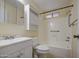 Bathroom features a modern sink with storage and a shower-tub combination at 9710 N 55Th Ave, Glendale, AZ 85302