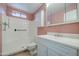 Bathroom with a walk-in shower, cabinet storage, and modern fixtures at 9710 N 55Th Ave, Glendale, AZ 85302