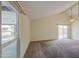 Bright living room with vaulted ceilings and sliding glass doors for natural light at 9710 N 55Th Ave, Glendale, AZ 85302