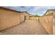 Side yard with gravel, fence and gate, creating a secure and private space at 9710 N 55Th Ave, Glendale, AZ 85302