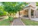 Great outdoor living space with covered patio, manicured lawn, and mature trees at , Gilbert, AZ 85234