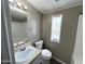 Bathroom features a sink, toilet, and tub with a shower at 1002 W Kachina Trl, Phoenix, AZ 85041