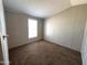Cozy bedroom with carpeted floors and a window providing natural light at 1002 W Kachina Trl, Phoenix, AZ 85041