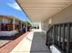 Attached carport offering covered parking, shade, and side access to the home at 1002 W Kachina Trl, Phoenix, AZ 85041