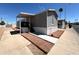 Mobile home featuring desert landscaping, covered parking, and a well-maintained exterior at 1002 W Kachina Trl, Phoenix, AZ 85041