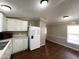 Functional kitchen with white appliances and plenty of cabinet space and counterspace at 1002 W Kachina Trl, Phoenix, AZ 85041