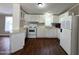 Functional kitchen with white appliances and plenty of cabinet space and counterspace at 1002 W Kachina Trl, Phoenix, AZ 85041
