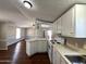 Functional kitchen with white appliances and plenty of cabinet space and counterspace at 1002 W Kachina Trl, Phoenix, AZ 85041