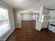 Open-concept living space featuring wood floors and natural light at 1002 W Kachina Trl, Phoenix, AZ 85041