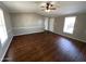 Comfortable living room with hard floors, a ceiling fan, and natural light at 1002 W Kachina Trl, Phoenix, AZ 85041