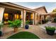 Charming backyard with covered patio, gravel, and a small patch of artificial turf at 10527 E Acacia Dr, Scottsdale, AZ 85255