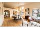 An open-concept dining and living area with modern furniture and natural lighting at 10527 E Acacia Dr, Scottsdale, AZ 85255