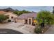 Charming single-Gathering home featuring a well-maintained front yard with desert landscaping at 10527 E Acacia Dr, Scottsdale, AZ 85255