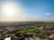 Scenic aerial view of golf course, highlighting lush greens and community amenities at 10527 E Acacia Dr, Scottsdale, AZ 85255