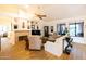 Comfortable living room with fireplace, built-in shelves, and backyard access at 10527 E Acacia Dr, Scottsdale, AZ 85255