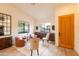 Bright living room featuring neutral walls, modern decor, and natural light at 10527 E Acacia Dr, Scottsdale, AZ 85255