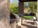 Built-in outdoor kitchen featuring stainless steel grills, counter space, and a shaded dining area for entertaining at 10527 E Acacia Dr, Scottsdale, AZ 85255