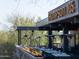 Stylish restaurant patio with fire features, comfortable seating, and modern decor for outdoor dining at 10527 E Acacia Dr, Scottsdale, AZ 85255