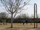 Community soccer field with players in action, offering a recreational space for sports and outdoor activities at 10527 E Acacia Dr, Scottsdale, AZ 85255