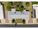 Aerial view of a home with a well-maintained roof, tidy landscaping, and a manicured lawn at 10860 W Cheryl Dr, Sun City, AZ 85351
