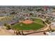 Wide aerial view of a baseball field in a quiet neighborhood at 10860 W Cheryl Dr, Sun City, AZ 85351