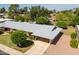 An aerial view shows this charming home and well-maintained landscaping at 10860 W Cheryl Dr, Sun City, AZ 85351