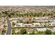 A quiet neighborhood featuring a home with meticulous landscaping at 10860 W Cheryl Dr, Sun City, AZ 85351
