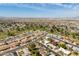 Wide aerial view of a residential neighborhood featuring neatly arranged homes at 10860 W Cheryl Dr, Sun City, AZ 85351