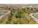 Aerial view of the community golf course and some of the nearby homes at 10860 W Cheryl Dr, Sun City, AZ 85351