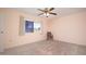 Bedroom features carpet, ceiling fan, and one window at 10860 W Cheryl Dr, Sun City, AZ 85351