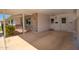 Close up of a well lit covered carport, showing entryway doors and brick facade at 10860 W Cheryl Dr, Sun City, AZ 85351