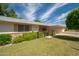 Low angle photo showcasing the facade and landscaping of this charming single story home at 10860 W Cheryl Dr, Sun City, AZ 85351