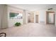 Large living area with ample natural light and plush carpeting is move-in ready at 10860 W Cheryl Dr, Sun City, AZ 85351