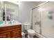 Standard bathroom with a glass enclosed shower and wood vanity at 1116 S 53Rd St, Mesa, AZ 85206