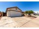 Exterior view featuring a spacious driveway leading to the attached two-car garage at 1116 S 53Rd St, Mesa, AZ 85206