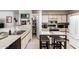Functional kitchen with white cabinets, ample counter space, and an eat-in dining area at 1116 S 53Rd St, Mesa, AZ 85206