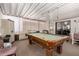 The enclosed patio features a pool table for indoor and outdoor entertainment and relaxing at 1116 S 53Rd St, Mesa, AZ 85206