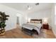 Comfortable bedroom with a queen-sized bed, bench, and soft lighting, creating a relaxing atmosphere at 11500 E Cochise Dr # 1015, Scottsdale, AZ 85259