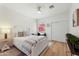 Inviting bedroom features a white bed frame, a desk and bright sunlight from a window at 11500 E Cochise Dr # 1015, Scottsdale, AZ 85259