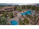Stunning community pool with hot tub and lounge area, set against a backdrop of lush landscaping and desert sunset at 11500 E Cochise Dr # 1015, Scottsdale, AZ 85259