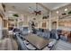 A large dining area with community tables and chairs is ideal for gatherings, events, and shared meals for residents at 11500 E Cochise Dr # 1015, Scottsdale, AZ 85259