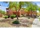 Beautiful landscaping and attractive exterior facade with mature shade tree at 11500 E Cochise Dr # 1015, Scottsdale, AZ 85259