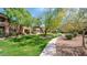 Scenic view of lush green community space with trees, landscaping, and a walking path, perfect for enjoying the outdoors at 11500 E Cochise Dr # 1015, Scottsdale, AZ 85259