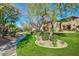 Beautiful lush green space with walking path, landscaping, and trees near apartments, perfect for an outdoor stroll at 11500 E Cochise Dr # 1015, Scottsdale, AZ 85259