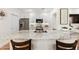 Spacious kitchen island with modern countertop, breakfast bar, and stainless steel sink for cooking and entertaining at 11500 E Cochise Dr # 1015, Scottsdale, AZ 85259