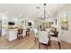 Bright and airy living space featuring stylish furnishings, wood flooring and an open layout to the kitchen at 11500 E Cochise Dr # 1015, Scottsdale, AZ 85259