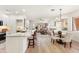 Open-concept living space featuring a kitchen island, dining area, and comfortable seating for easy living at 11500 E Cochise Dr # 1015, Scottsdale, AZ 85259