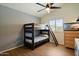 Bedroom with hard floors, a ceiling fan, and a bunk bed at 1221 E Claire Dr, Phoenix, AZ 85022