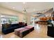 Spacious living room featuring tile floors, ceiling fans, and open access to the kitchen at 1221 E Claire Dr, Phoenix, AZ 85022